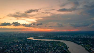 Aerial view of an Indian city with river during twilight