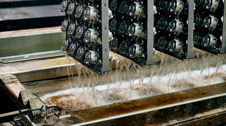 racks of newly die-cast components by first rinsing pool in the ced surface treatment system