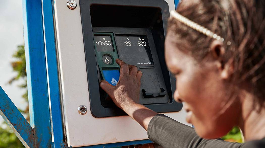 villager buying water from grundfos aq tap atm